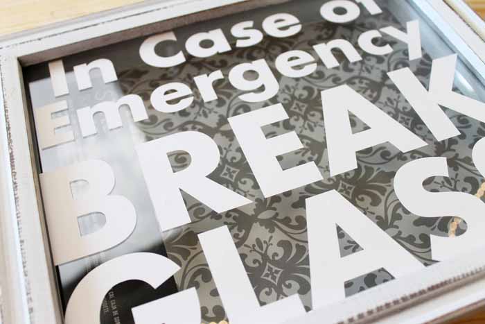 Remove the transfer tape, leaving the vinyl letters on the shadowbox glass